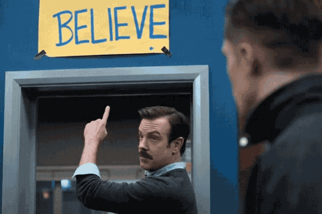 Ted Lasso Afc Richmond GIF, pointing to the believe sign