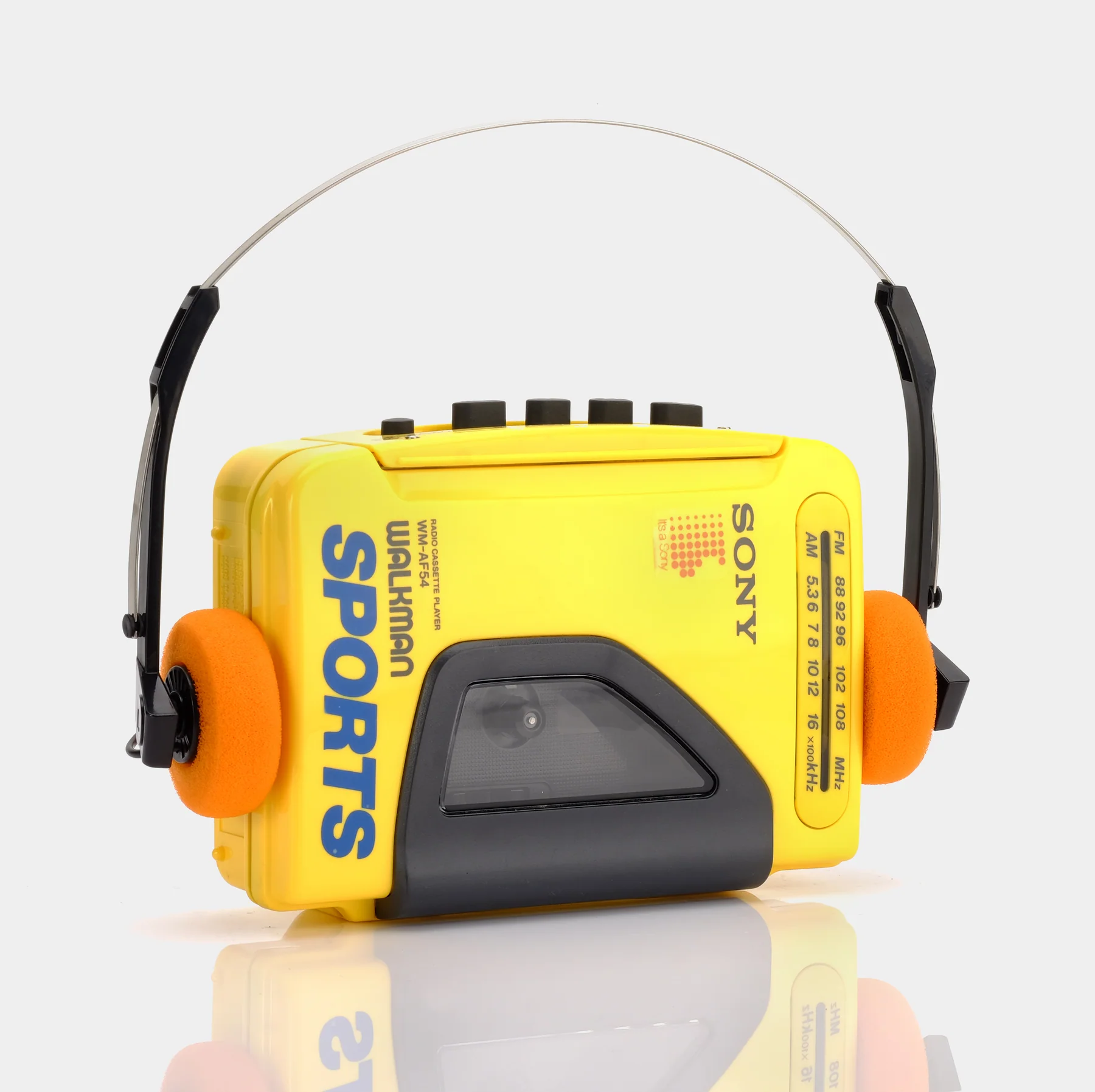 SONY SPORTS WALKMAN WM-AF54 YELLOW AM/FM PORTABLE CASSETTE PLAYER, front with headphones